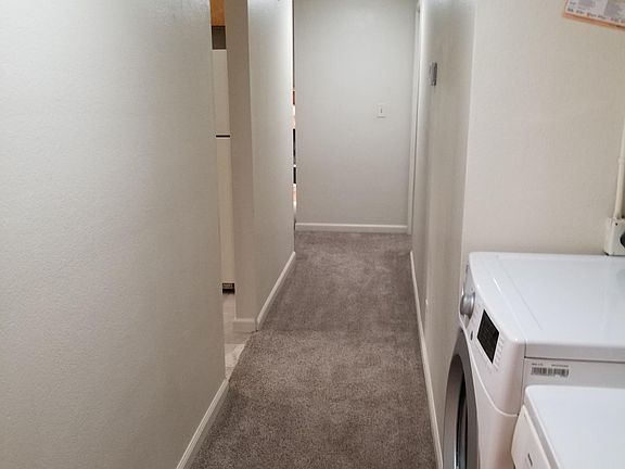walkway to the kitchen, living, and master bed