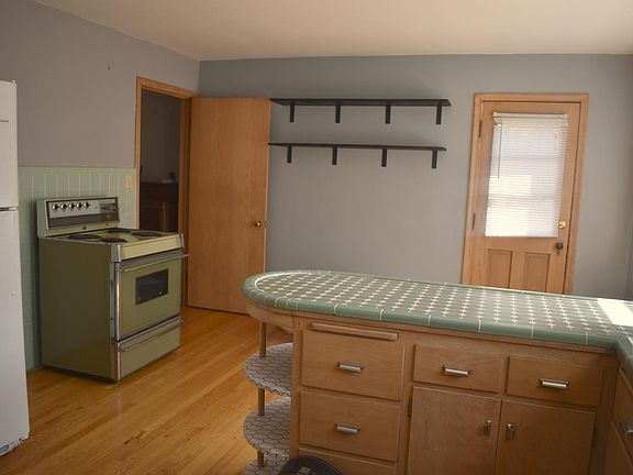 Shelving can stay if you prefer. Lots of storage in the spacious kitchen.