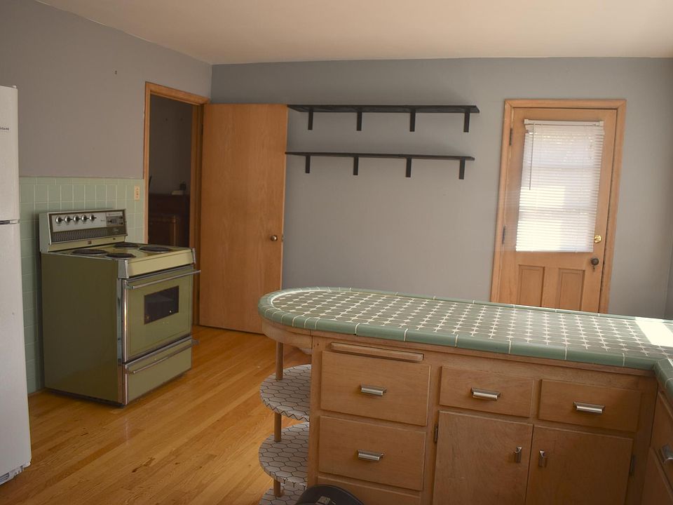 Shelving can stay if you prefer. Lots of storage in the spacious kitchen.