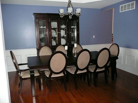 Formal Dining Room w/ Coffered Ceiling & Framed Chair Rail