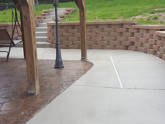 covered patio/stone wall