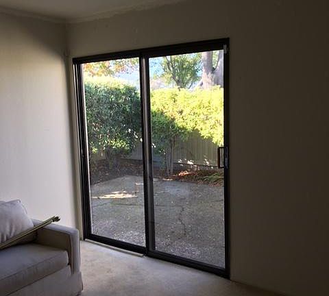 Bedroom #2 with view to patio