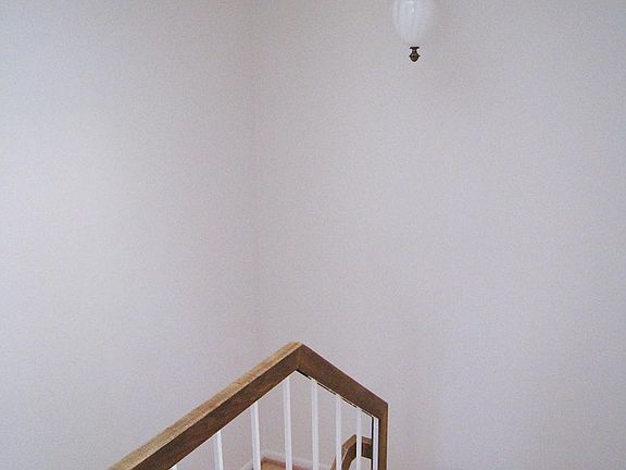 Stairwell from bedrooms down to kitchen/dining room level