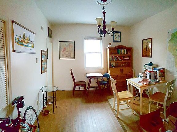 Dining room, with kitchen entrance far left and living room 