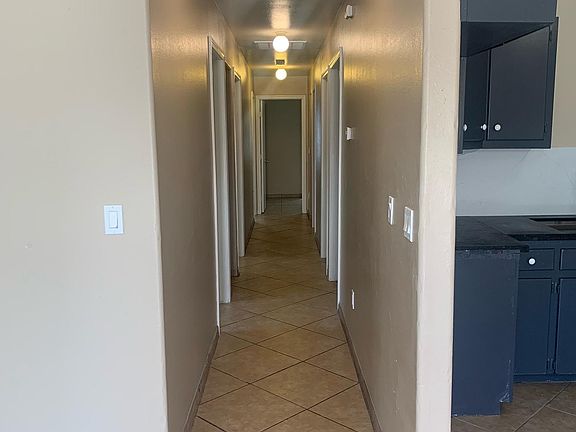 hallway to 4 bedrooms 2 bathrooms and laundry room