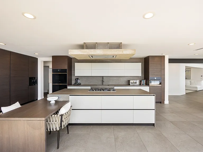 High-quality appliances, including a premium stove, oven, refrigerator, and dishwasher, cater to every culinary need.