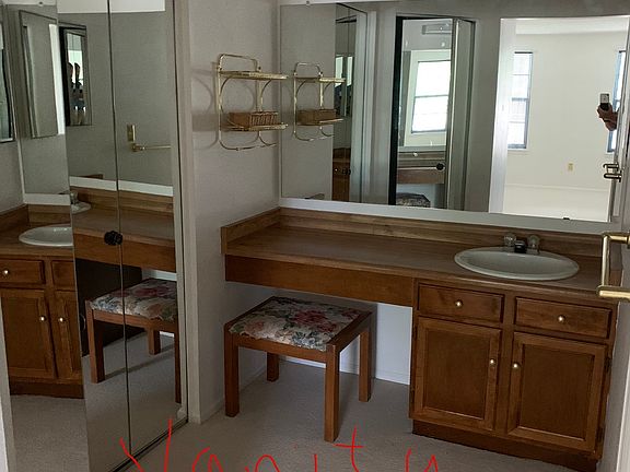 Vanity in Main Bedroom, with mirrored closet doors