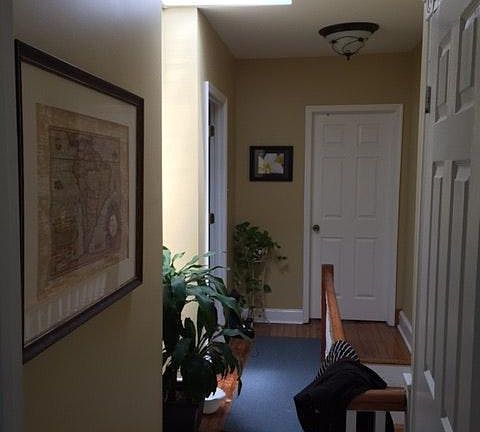 View of upstairs hallway towards back of house
