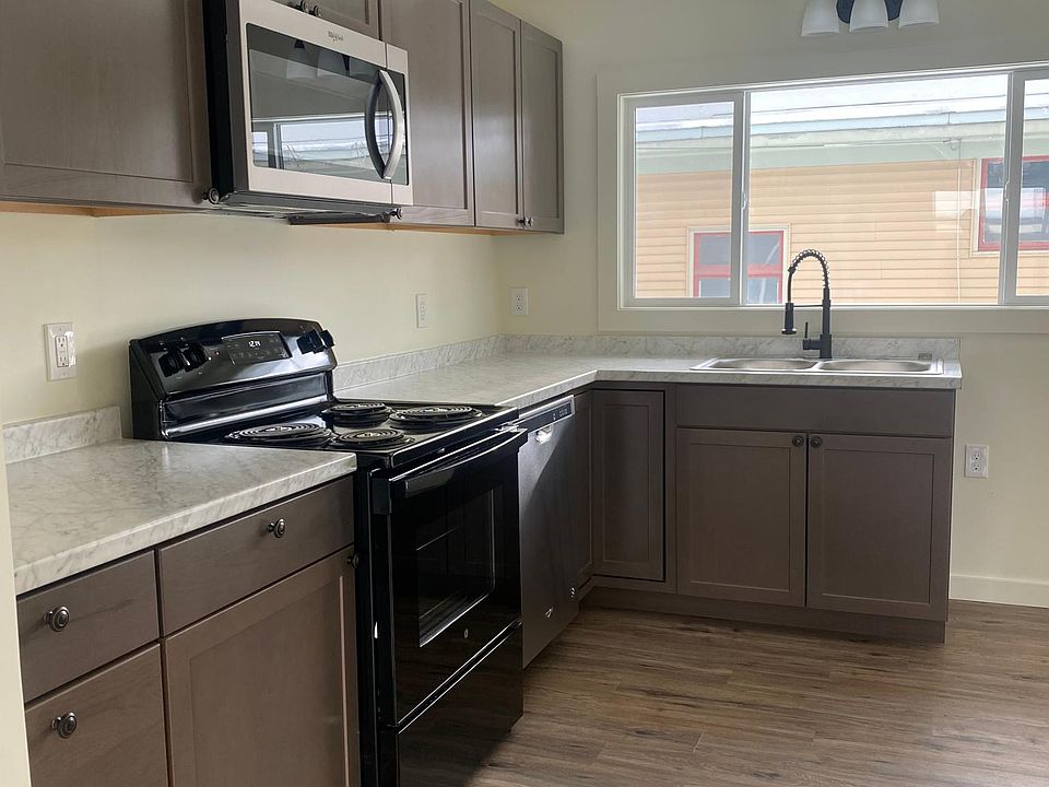 Kitchen with all brand new appliances and cabinets. Dining room not pictured, but photo was taken standing in it
