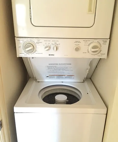 Unit F washer/dryer in hall closet