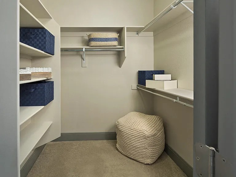 Spacious walk-in closets with built-in shelving