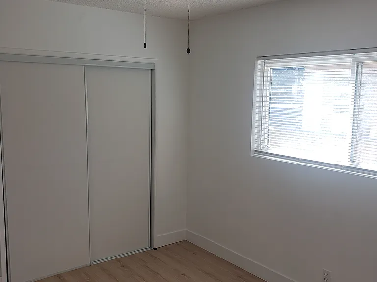 Bedroom 2 - ceiling fan. laminate flooring in both bedrooms.