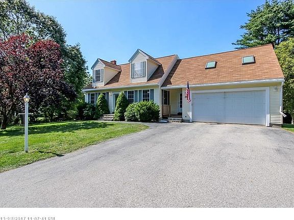 Large paved driveway with 2 Car garage.