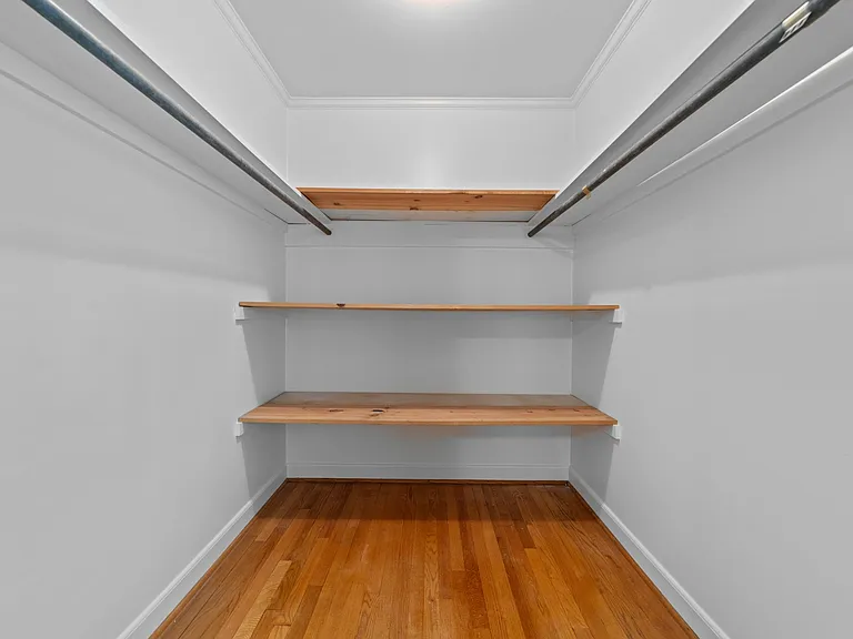Large walk-in closet in secondary bedroom.