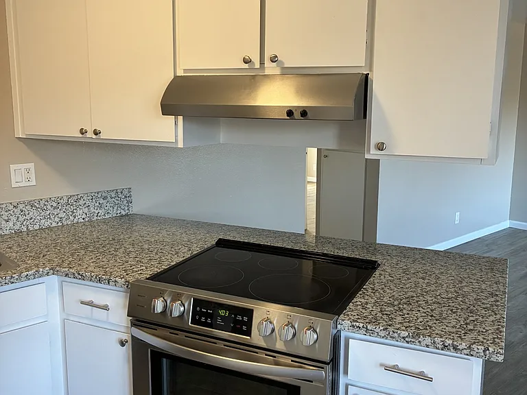 All full sized -stainless steel appliances. Granite countertops