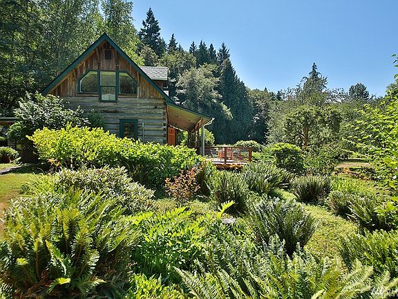 Woodland borders for complete privacy, yet plenty of cleared acreage for lots of sunshine....enough to nourish the abundant gardens, berry patches & orchard!