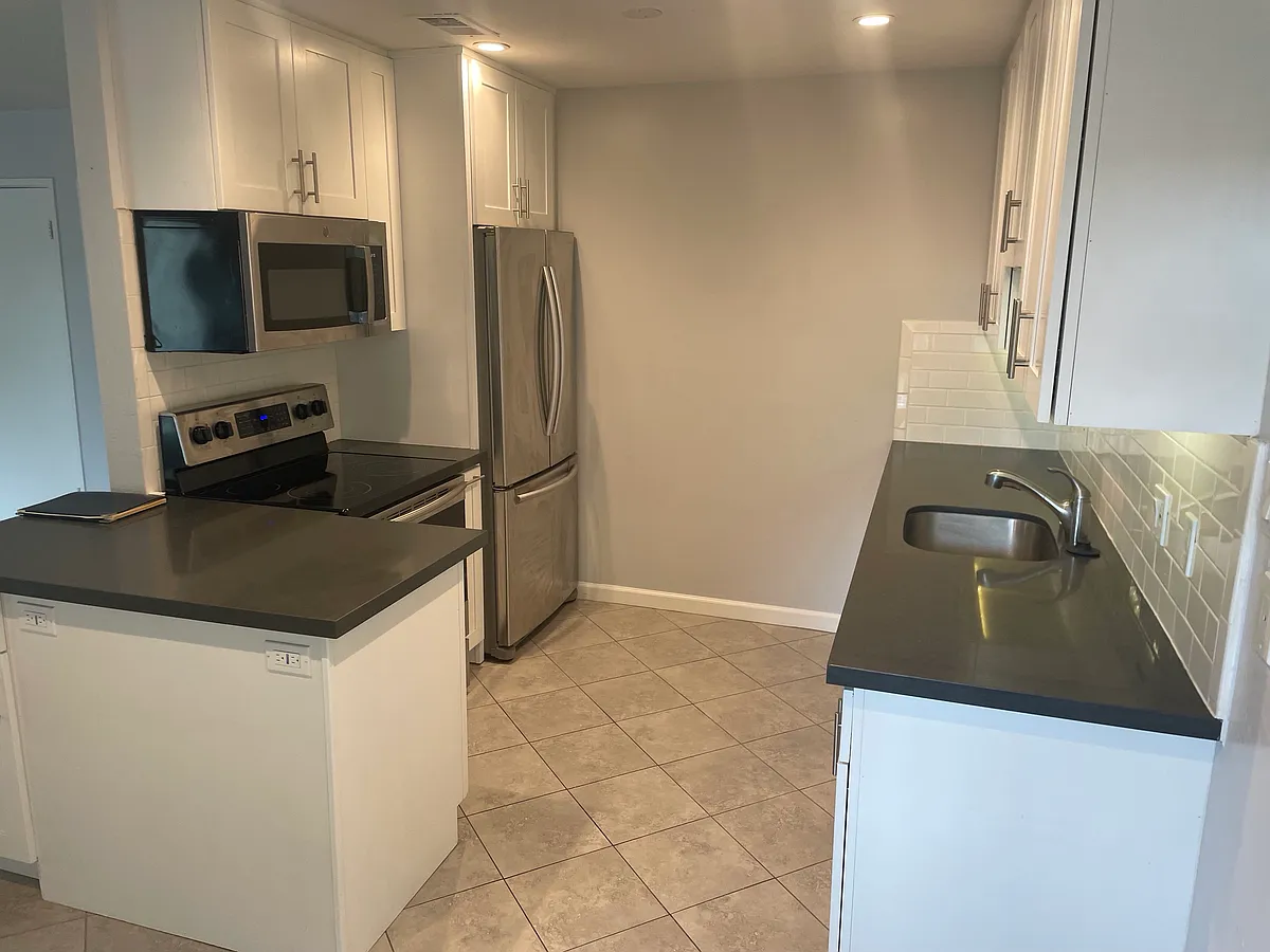 Building Photo - 3001 Los Prados St #205