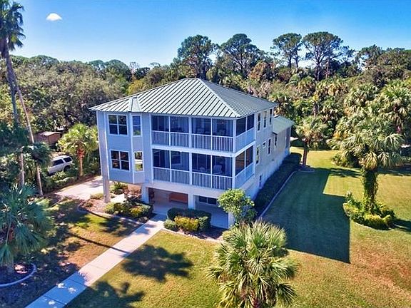 Duel screened water view balconies -  from the master suite upper level and living area PLUS open covered porch at the lower/bot