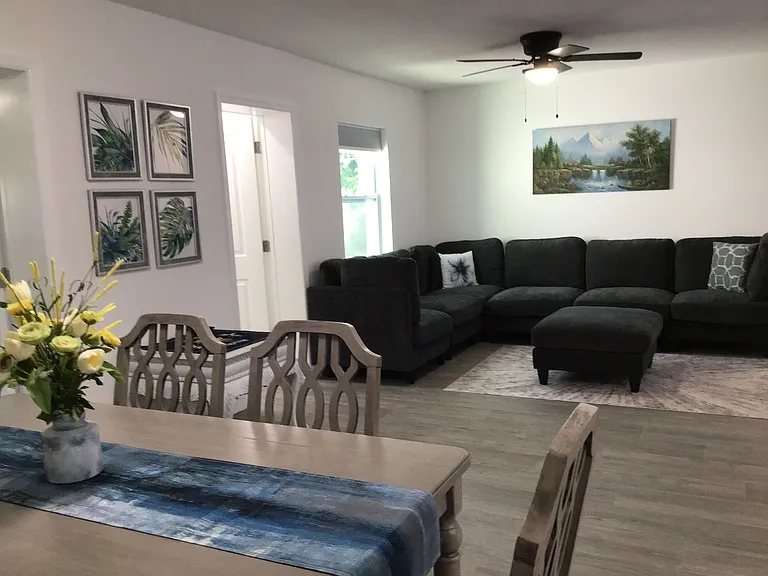 Clean modern living space with seamless sightlines and premium entertainment setup.