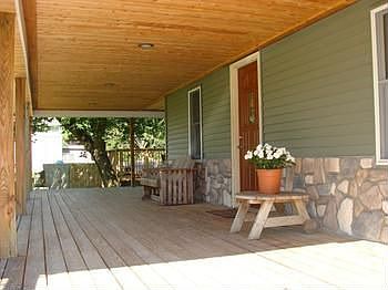 side covered porch that over looks the pool