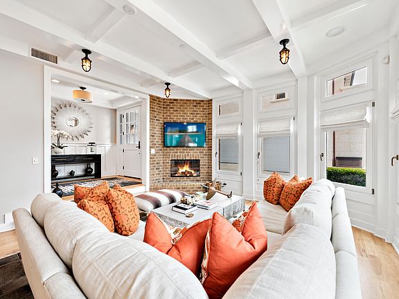 Beautifully furnished family room looking toward front door.