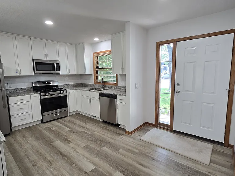 Updated kitchen with SS appliances including dishwasher.