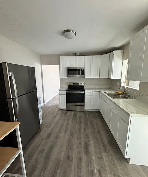 View of kitchen from bedroom entrance
