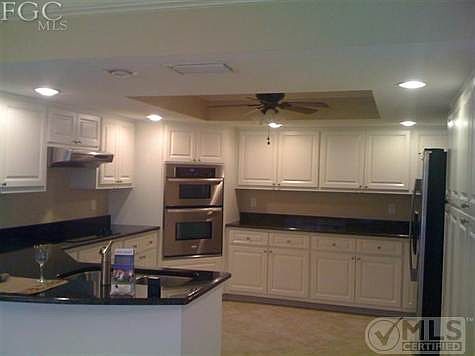Oversized kitchen complete with granite, stainless steel appliances and more cabinets than you can use.