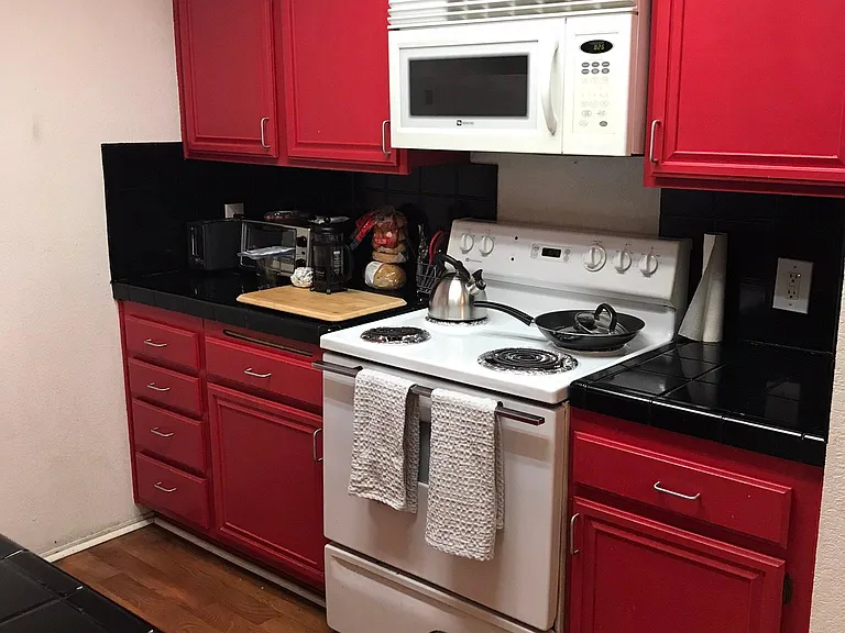 Condo is done in retro vibe. Kitchen is perfect size and faces towards living room. Lots of storage.