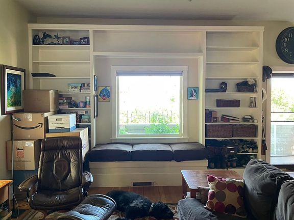 built-in bookshelves and window seat in living room