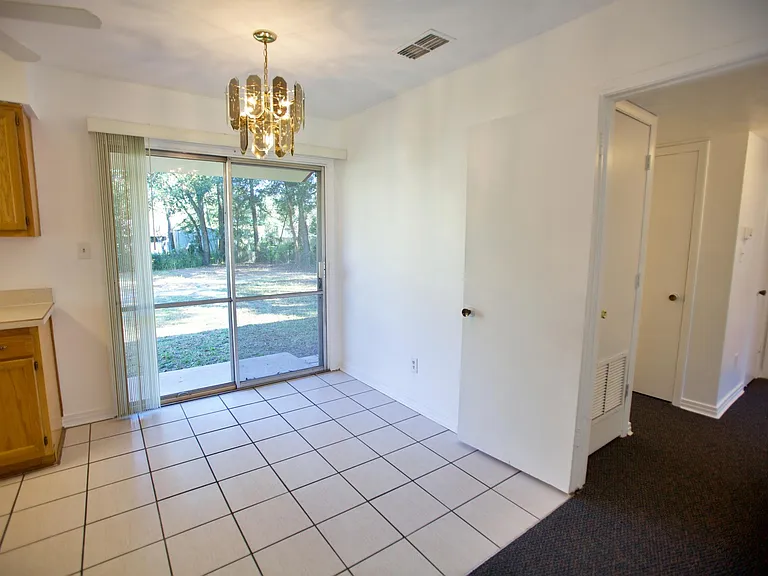 Dining area and slider to backyard
