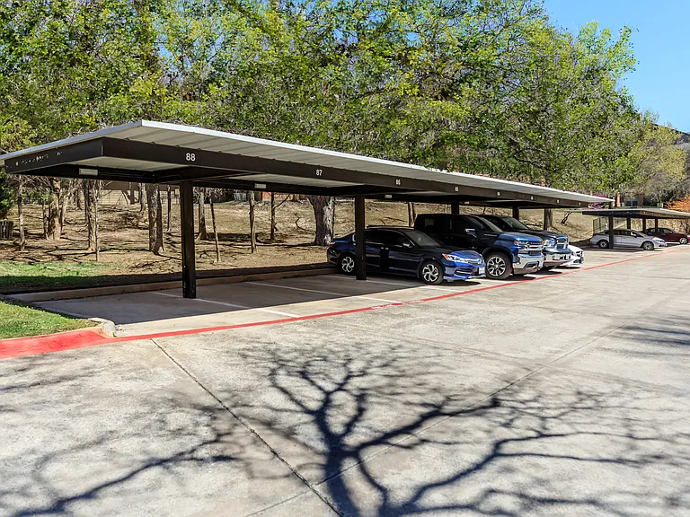Covered Parking for Comfort and Convenience at The Woods of Five Mile Creek in Dallas