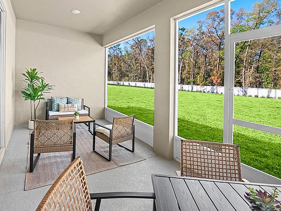 Your interior opens to desirable outdoor living space on your covered lanai - Summerlyn II by Highla