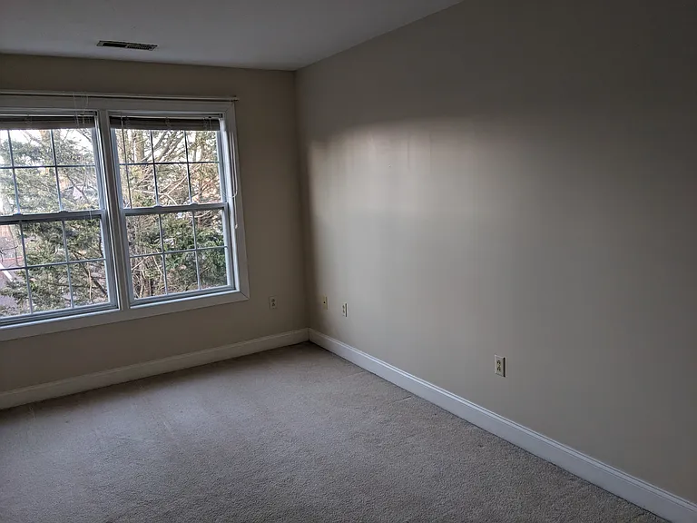 View of the room's front wall facing toward the right wall.