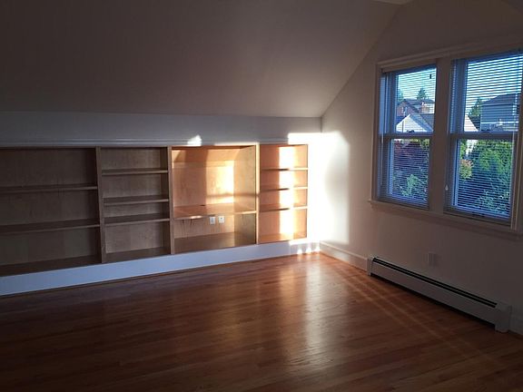 Living room with recessed shelves.