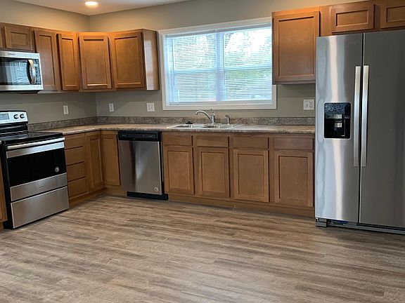 Kitchen space with all new appliances- Stove, Refrigerator, Dishwasher, and Microwave