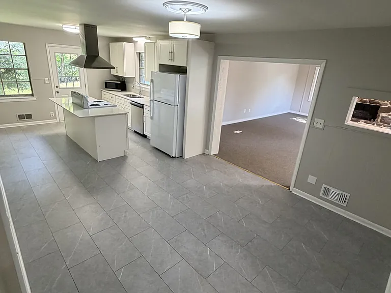 Breakfast/dining area & kitchen, with large living room past it