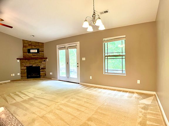 Large Family room has a gas fireplace and exit to back yard and patio