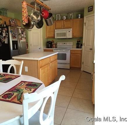 Kitchen has double pantries