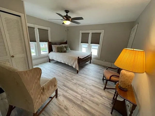Spacious primary bedroom with abundant natural light, generous closet space, and plenty of room for a king-size bed and additional furniture.
