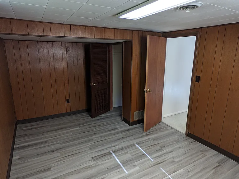 Forth bedroom located in the basement. Entry view.