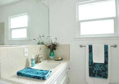 Guest bathroom with tub & shower.