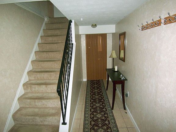 Foyer leads from the main entrance to the office and upstairs