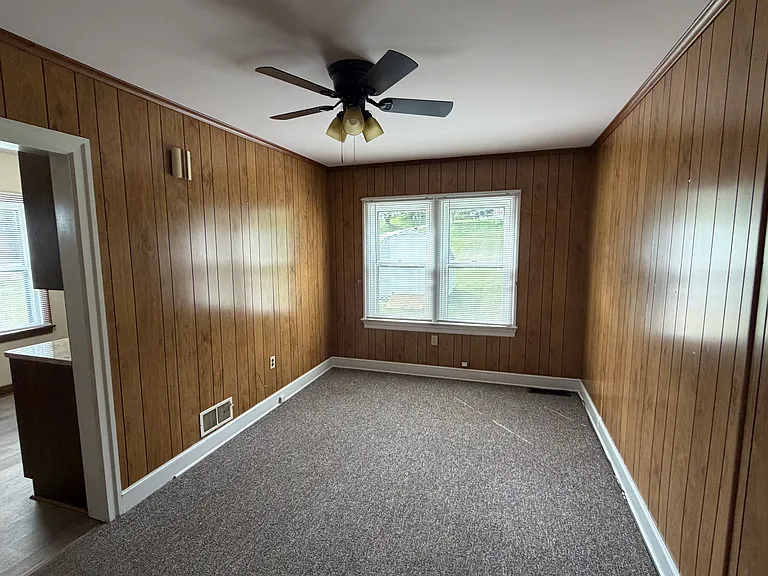 Dining room, entrance from kitchen or living room. New ceiling fan.