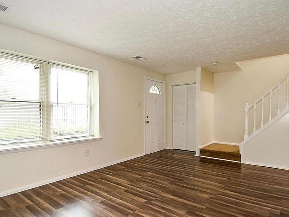 Living space facing front door/foyer closet