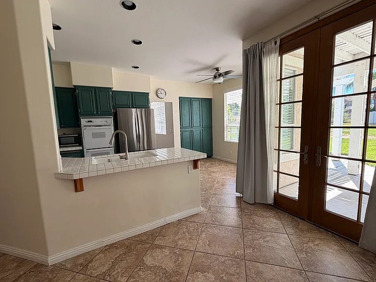 View of kitchen from back living room.