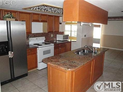 Updated cabs and granite tops with island kitchen.