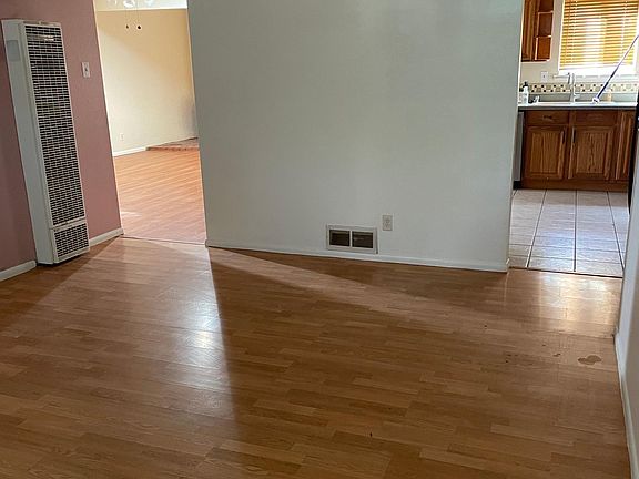 Your POV as you enter front door and are standing in the 1st living room. This is a large room