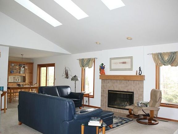 You'll feel at home right away in this open casual floor plan.br /Light and airy with vaulted ceilings, skylights, and cozy wood- burning fireplace.