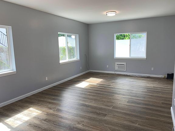Large living space with plenty of natural light. Could be used as a bedroom, office, or even a combination of the two.